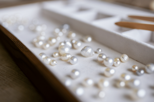 A tray of an array of Australian South Sea and Australian Akoya pearls of different colours, shapes, sizes.