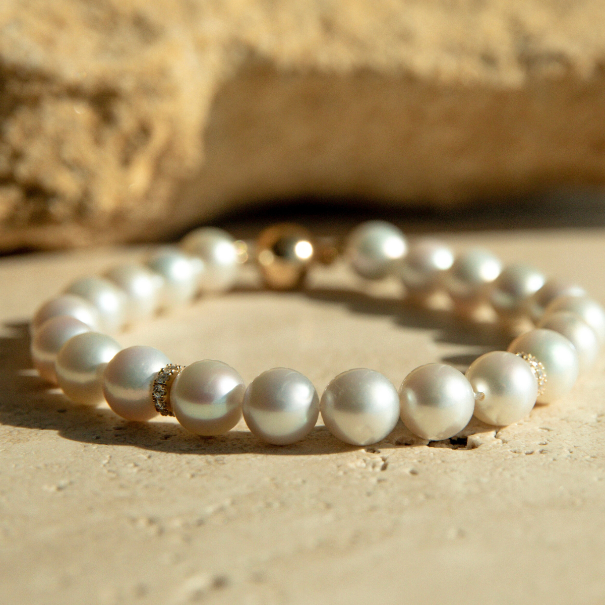This Eternal Akoya & Diamond Strand Bracelet features twenty-one (21) Broken Bay (NSW) grown 7.5mm AAA grade Australian Akoya pearl set alongside two White Diamond rondels (0.22ct H/SI). This 18.5cm pearl strand is carefully hand strung with silk and set with an 18ct Yellow Gold Ball Clasp.
