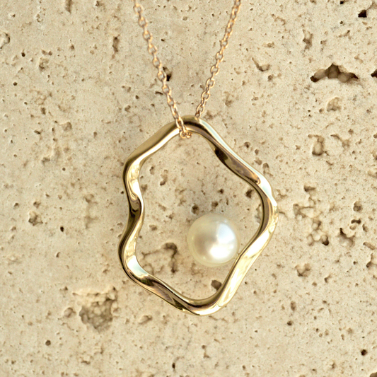 A graceful Flow Pearl Pendant featuring a Broken Bay (NSW) grown 7mm AA grade Australian Akoya Pearl set in an organic gold plated sterling silver design.