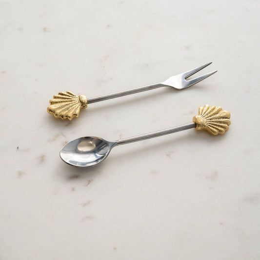 This set includes two beautifully crafted utensils, a spoon and a fork, both adorned with intricate seashell designs. Made from high-quality stainless steel, these utensils are not only durable but also resistant to rust and corrosion.