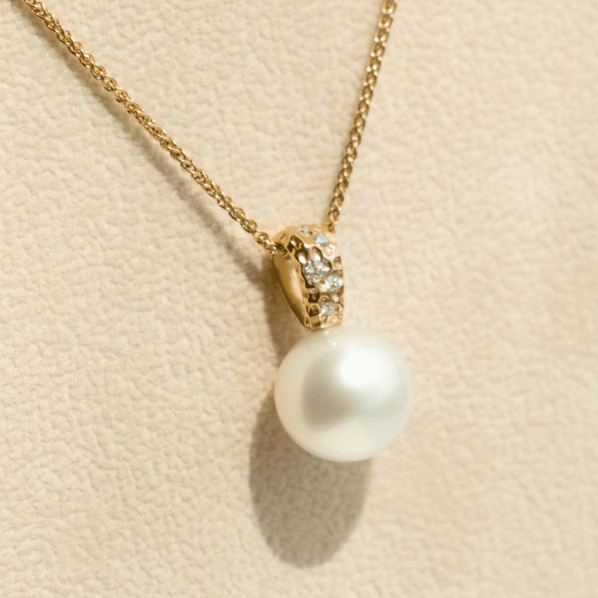 A stunning Australian South Sea pearl set on an Impressions pendant design featuring several white diamonds.