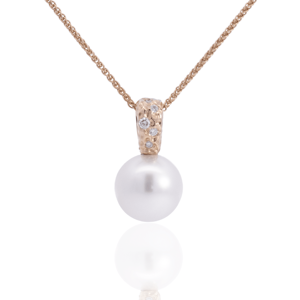 A stunning Australian South Sea pearl set on an Impressions pendant design featuring several white diamonds.