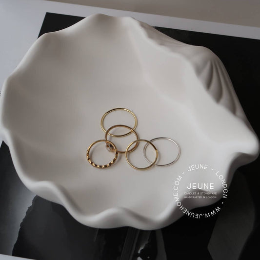 Made with an eco-resin, sealed against light stains and humidity and finished with small round feet on the bottom to protect your furniture from scratches. Perfect for holding jewellery, trinkets, and other small items.