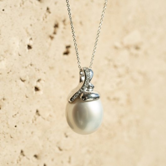 This stunning Keepsake Pearl Pendant features a Cygnet Bay (WA) grown  Australian South Sea complemented by 11 White Diamonds in a bespoke gold design.