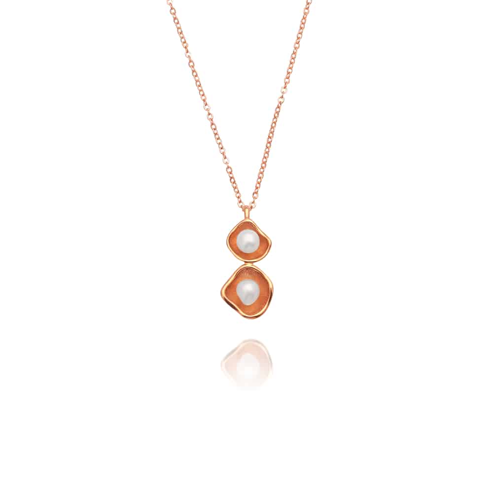A stunning Kimberley Lily twin pendant featuring a pair of Cygnet Bay grown Australian South Sea keshi pearls set in a unique lily inspired design, in rose gold.