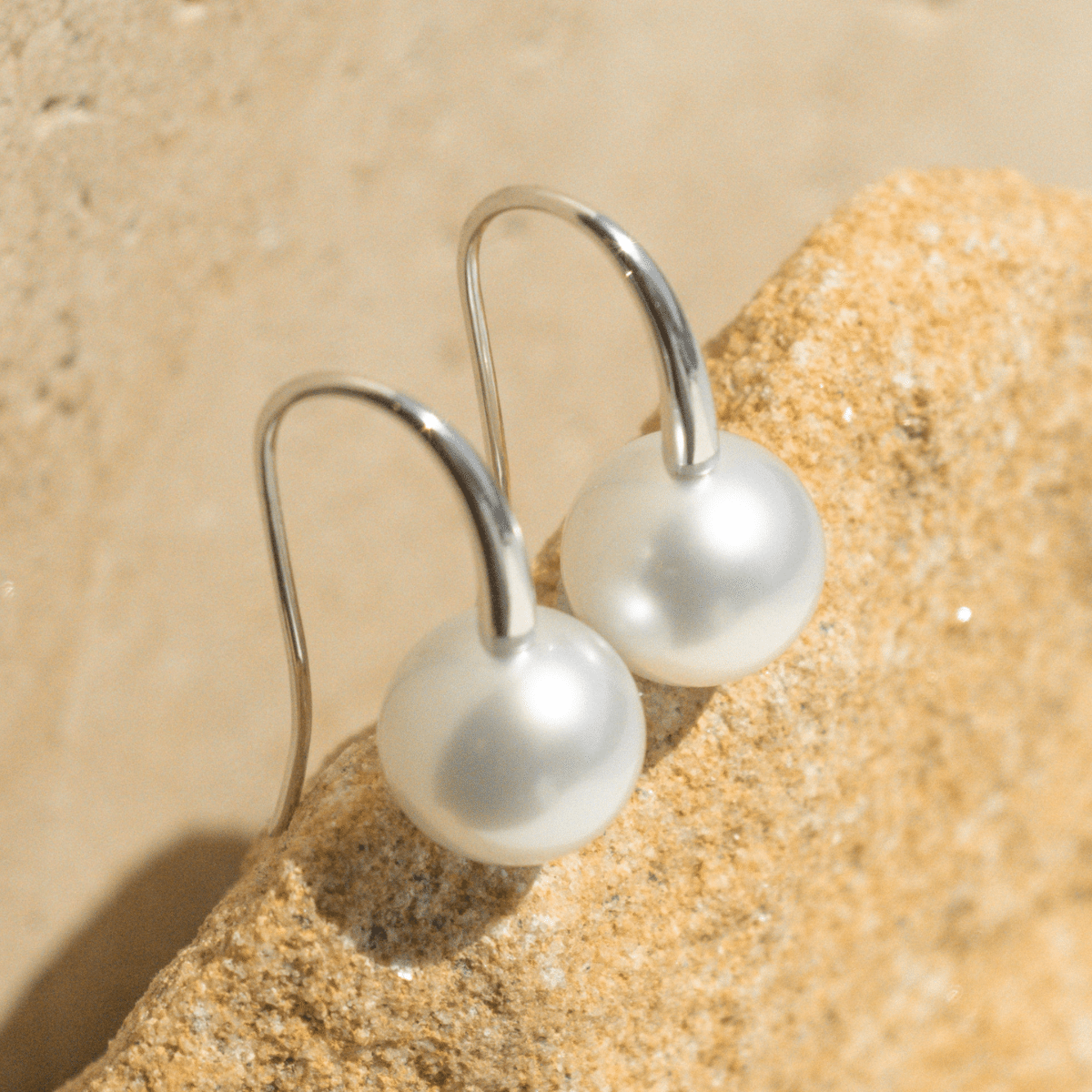 A pair of beautiful Australian South Sea pearls set on a pair of hook earrings in solid gold.