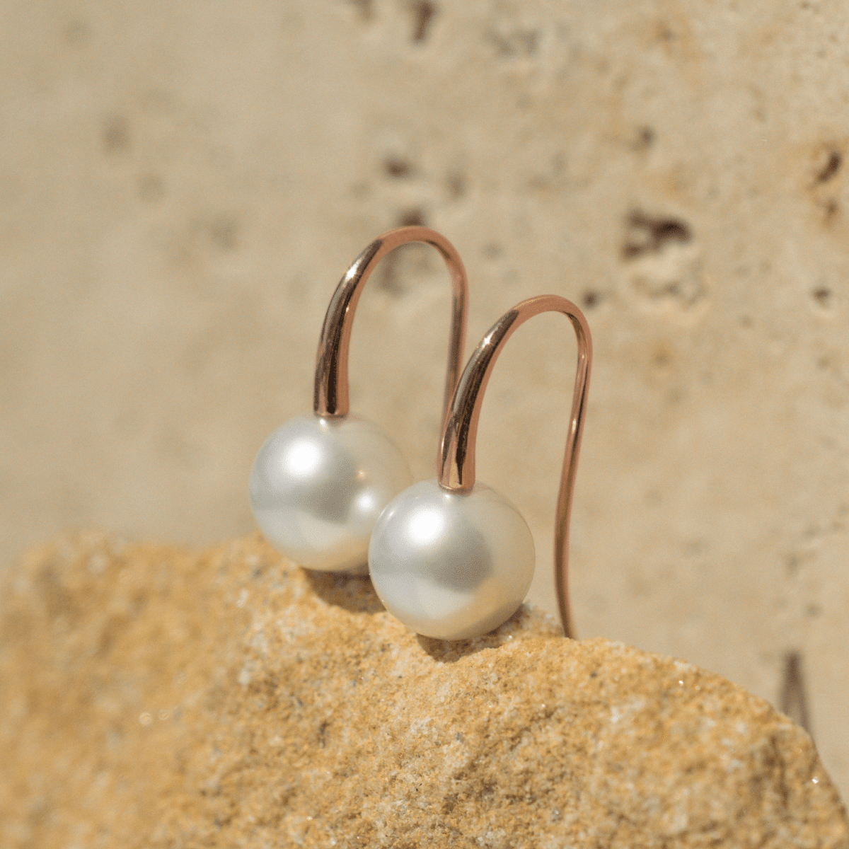 A pair of beautiful Australian South Sea pearls set on a pair of hook earrings in solid gold.