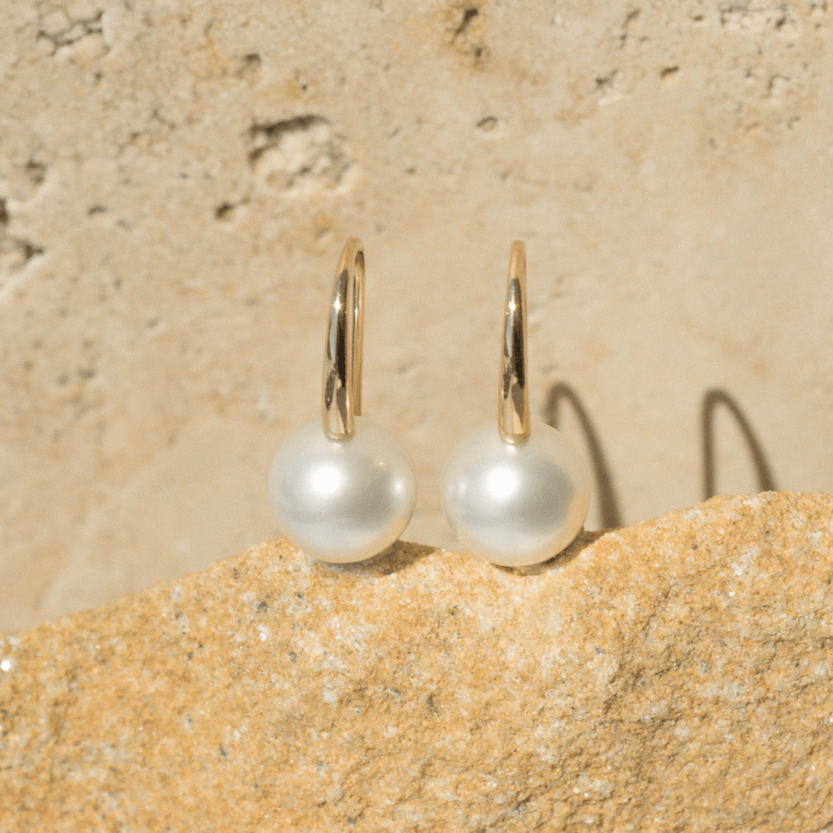 A pair of beautiful Australian South Sea pearls set on a pair of hook earrings in solid gold.