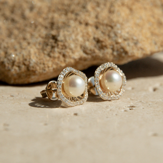 A stunning pair of Mangrove Lily Pearl & Diamond Studs featuring Broken Bay (NSW) 6.5mm AAA grade Australian Akoya pearls complemented by a halo of seventy-six (76) white diamonds set in 9ct gold.