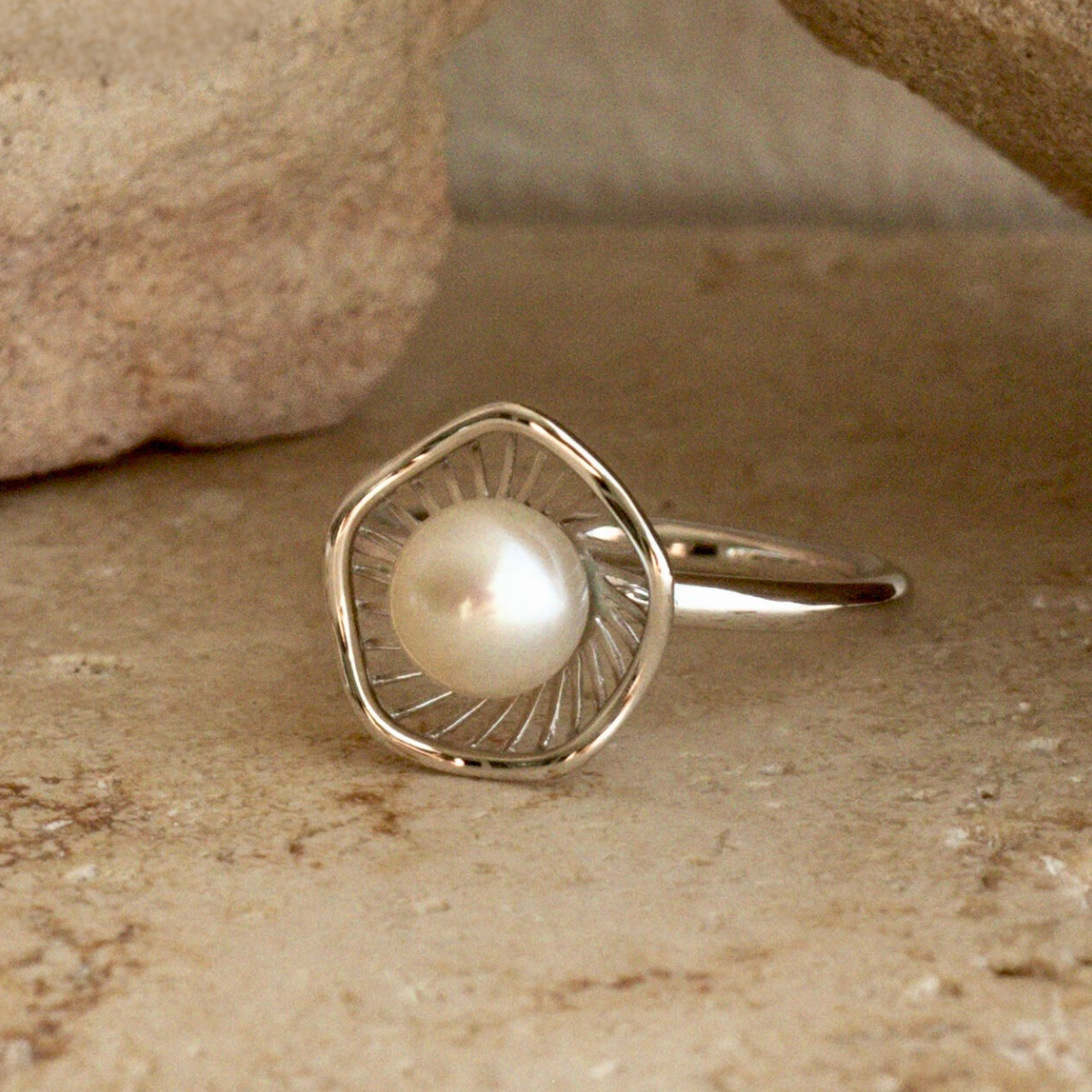 A stunning Mangrove Lily Pearl Ring featuring a Broken Bay (NSW) 7mm AAA grade Australian Akoya pearl set in 9ct gold. Mirroring the Mangrove Lily, the filigree metalwork featured in the design of this collection evokes the umbrella of petals belonging to this coastal marvel.