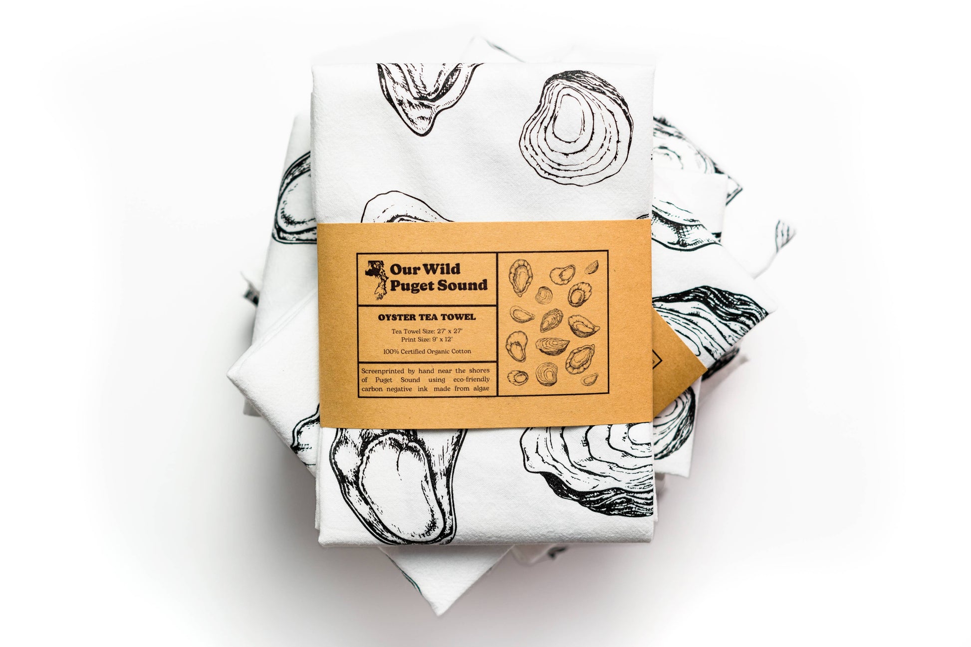 Oyster-themed tea towel with a cardboard label on a white background