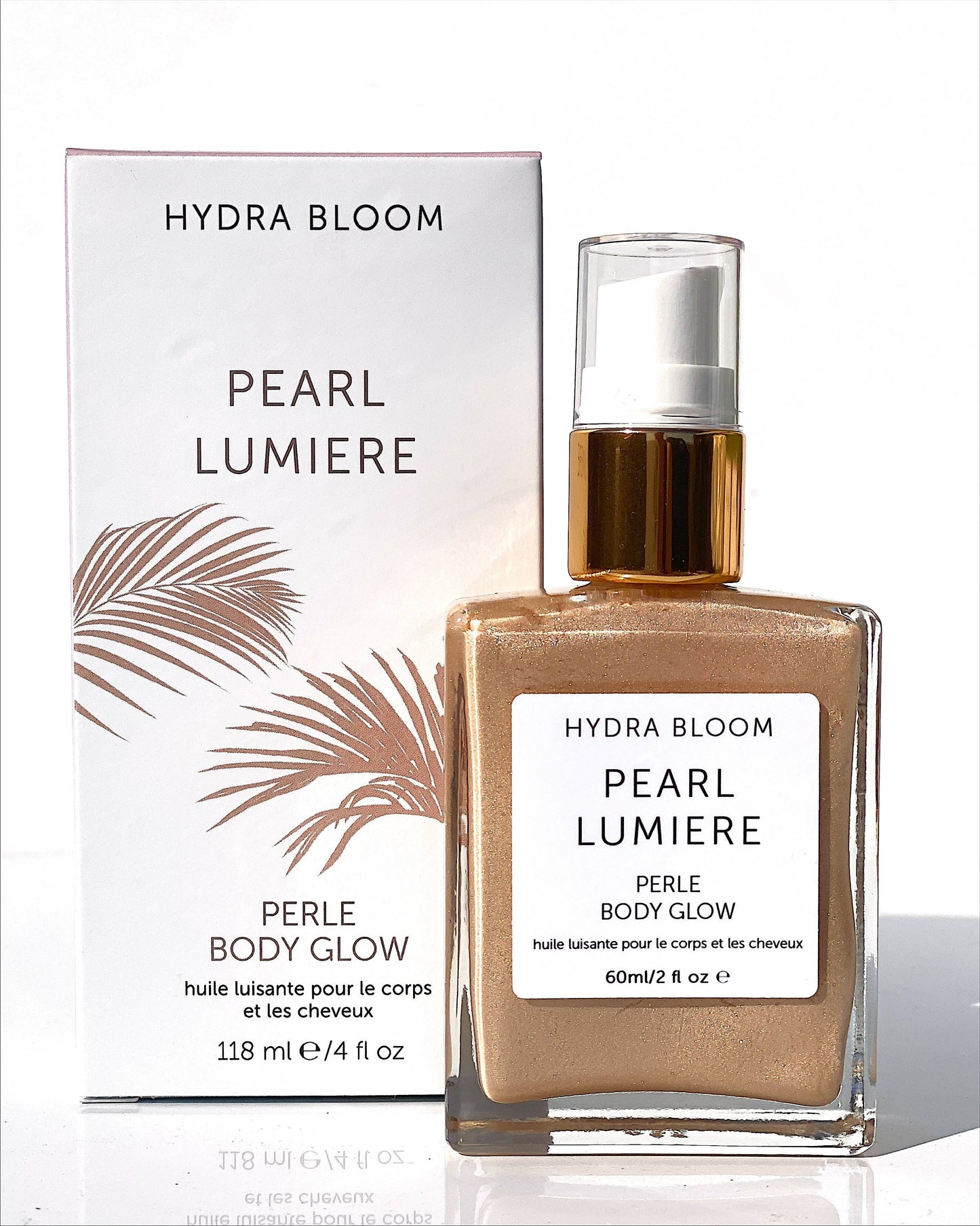 Shimmer like a luminous angel with pearl frangipani shimmer oil. Pearl is our champagne toned shimmer color which suits all skin tones. Ingredients: argan oil, coconut oil, mica minerals, flower essences. Pearl shimmer oil delivers luminous glowing skin.
