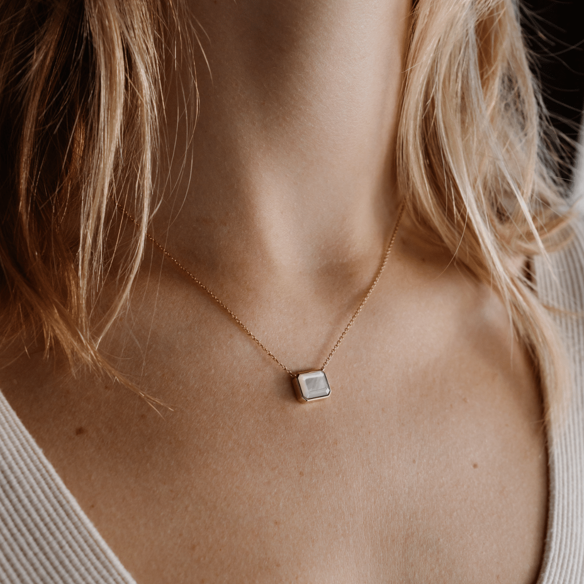 This stunning Radiance Emerald Cut Necklace features faceted Mother of Pearl grown at our Cygnet Bay Pearl Farm set on a gold chain.