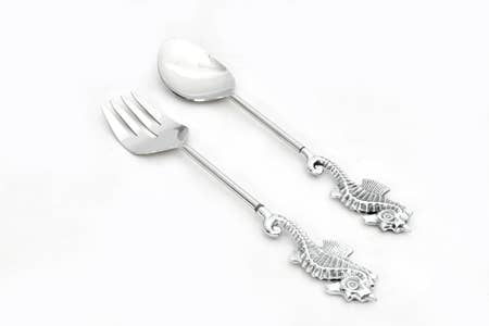Silver fork and spoon set with seahorse designs on a white background