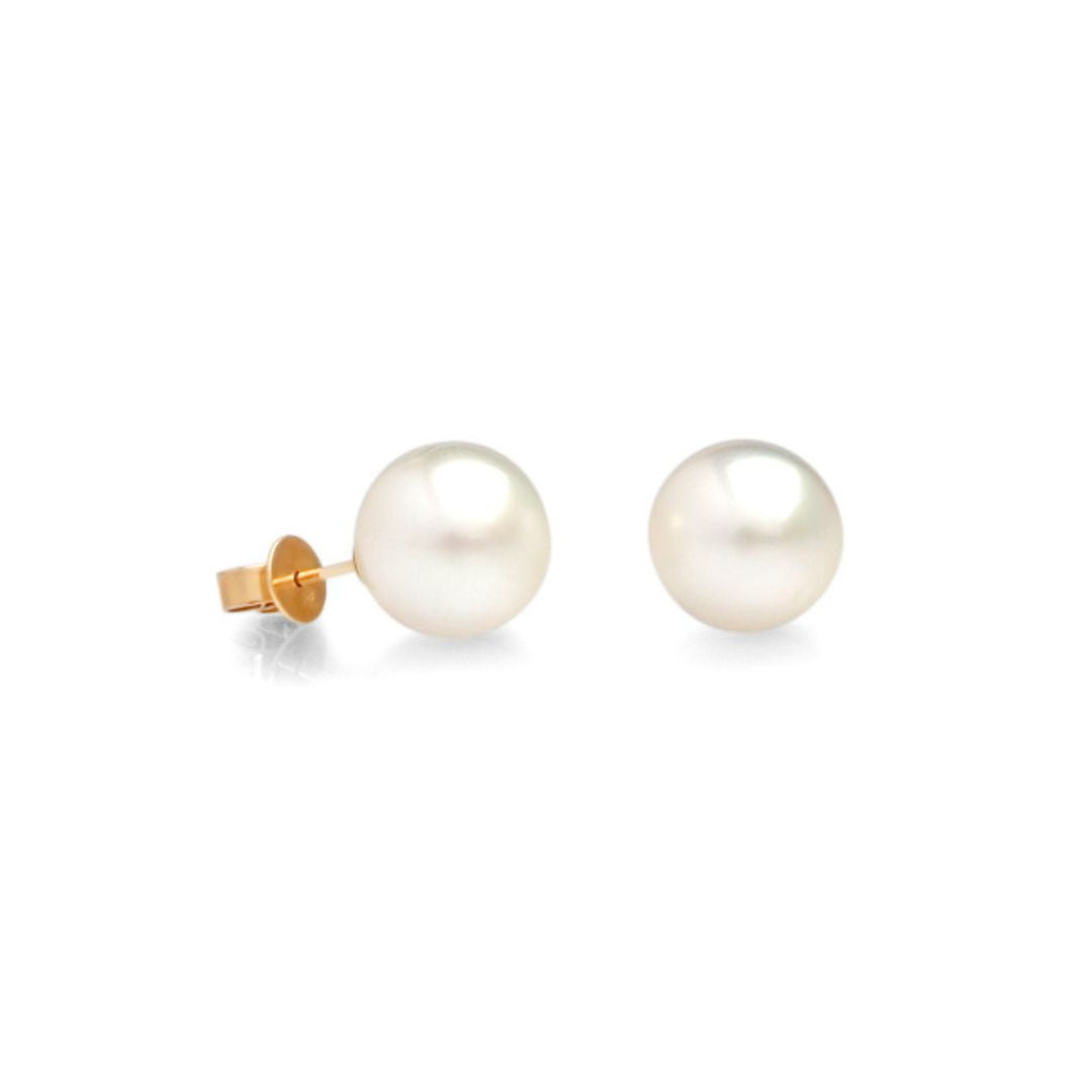 A pair of South Sea Pearl stud earrings set in yellow gold.