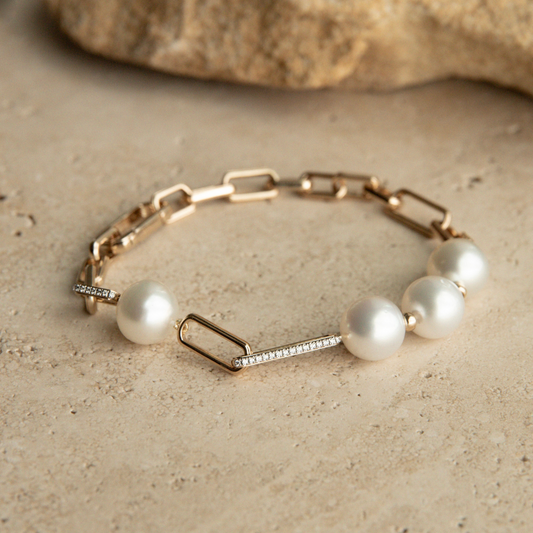A timeless Submerge South Sea Pearl & Diamond Bracelet featuring Cygnet Bay (WA) grown 11.5mm High Button A3/B1 grade Australian South Sea pearls complemented by twenty-four (24) White Diamonds (0.13ct H/SI) set on 9ct gold paperclip chain.