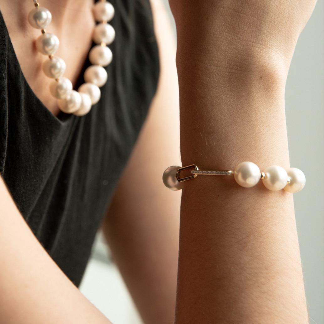 A timeless Submerge South Sea Pearl & Diamond Bracelet featuring Cygnet Bay (WA) grown 11.5mm High Button A3/B1 grade Australian South Sea pearls complemented by twenty-four (24) White Diamonds (0.13ct H/SI) set on 9ct gold paperclip chain.