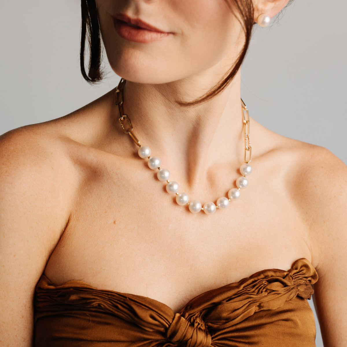 A timeless Submerge Pearl & Diamond Necklace features eleven (11) Cygnet Bay (WA) grown 11.5mm High Button B1 grade Australian South Sea pearls complemented by ninety (90) White Diamonds (0.61ct H/SI) set on 9ct gold paperclip chain with a double hinge clasp. 