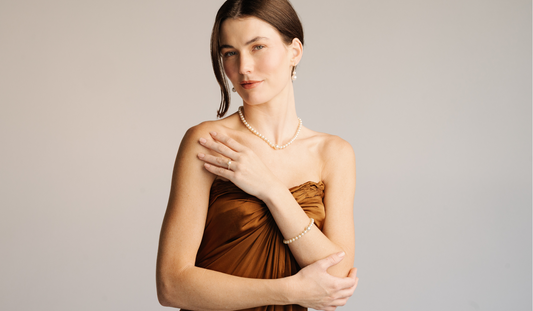 A woman wears her stunning pearl jewellery pieces gifted for a wedding anniversary.