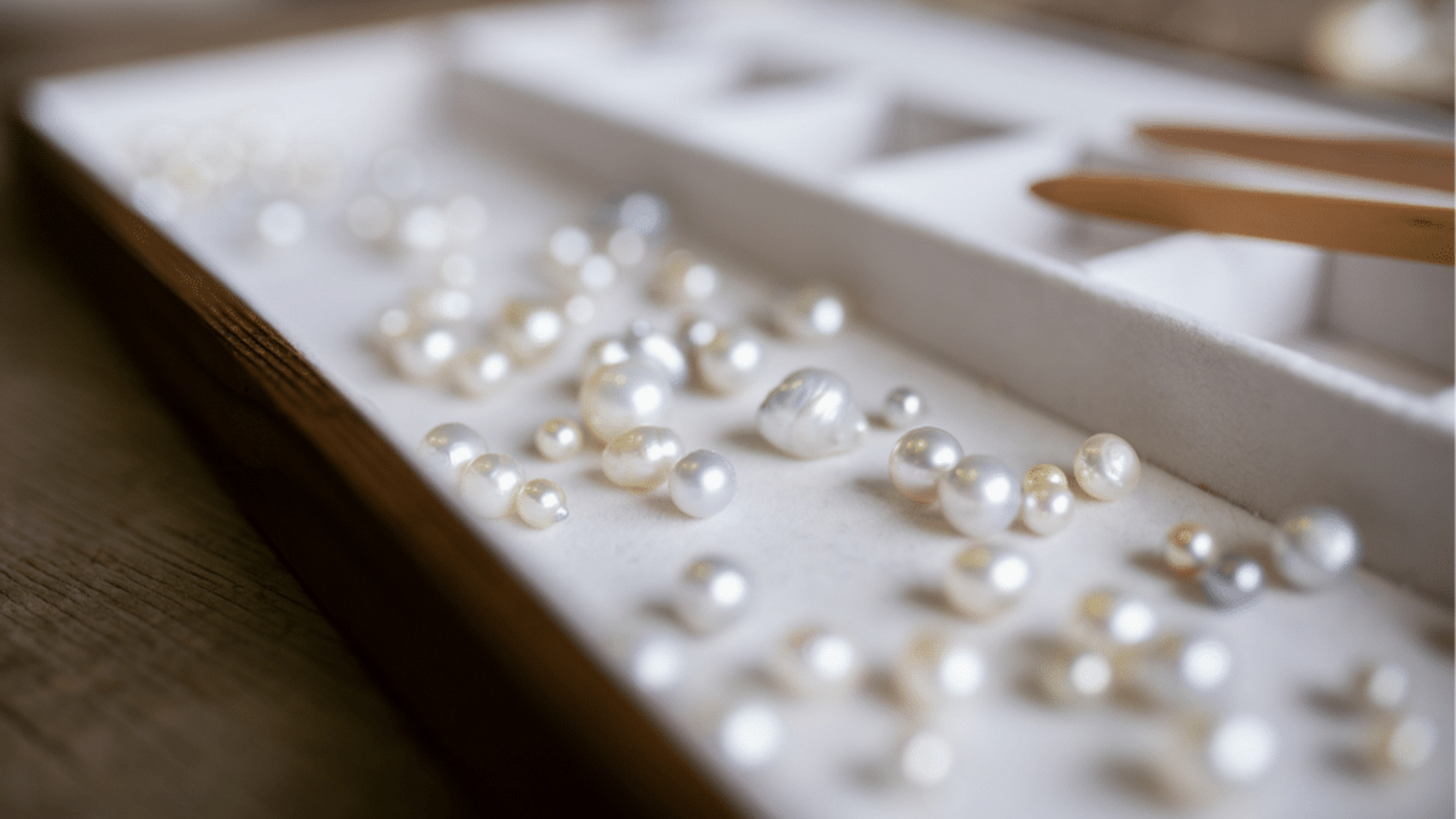 A tray of an array of Australian South Sea and Australian Akoya pearls of different colours, shapes, sizes.