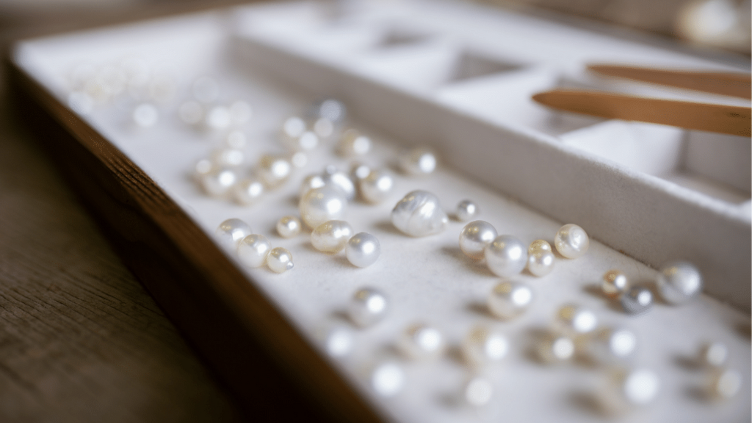 A tray of an array of Australian South Sea and Australian Akoya pearls of different colours, shapes, sizes. 