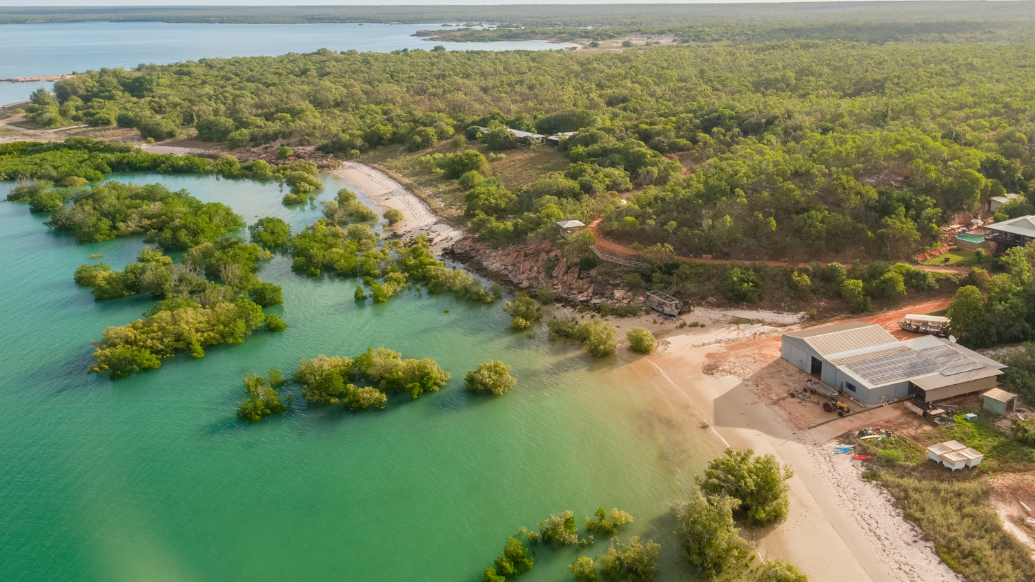 Aerial photo of our Cygnet Bay Pearl Farm. The beautiful turquoise waters amongst the lush green mangroves that provide the perfect environment for our Australian South Sea pearls to grow.