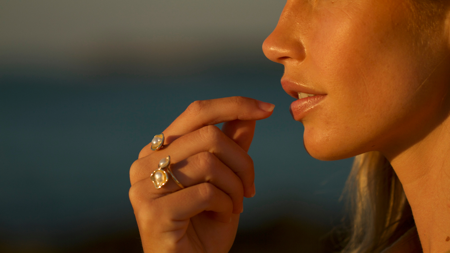 A woman wears her stunning Kimberley Lily Float Ring which features our Australian South Sea Keshi pearls set on a fine solid gold ring.