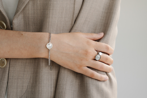 A person wears their Pearls of Australia gifts, some of which are our Mother of Pearl jewellery pieces.