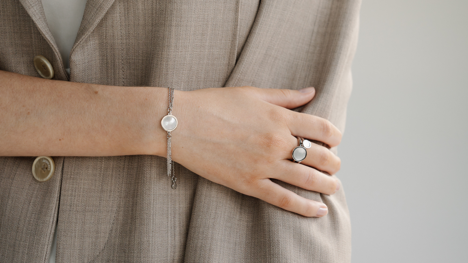 A person wears their Pearls of Australia gifts, some of which are our Mother of Pearl jewellery pieces.