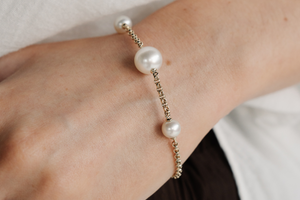 A woman wears her stunning Provenance Pearl Bracelet that feature Australia Akoya and South Sea pearls from both Broken Bay and Cygnet Bay Pearl Farm.