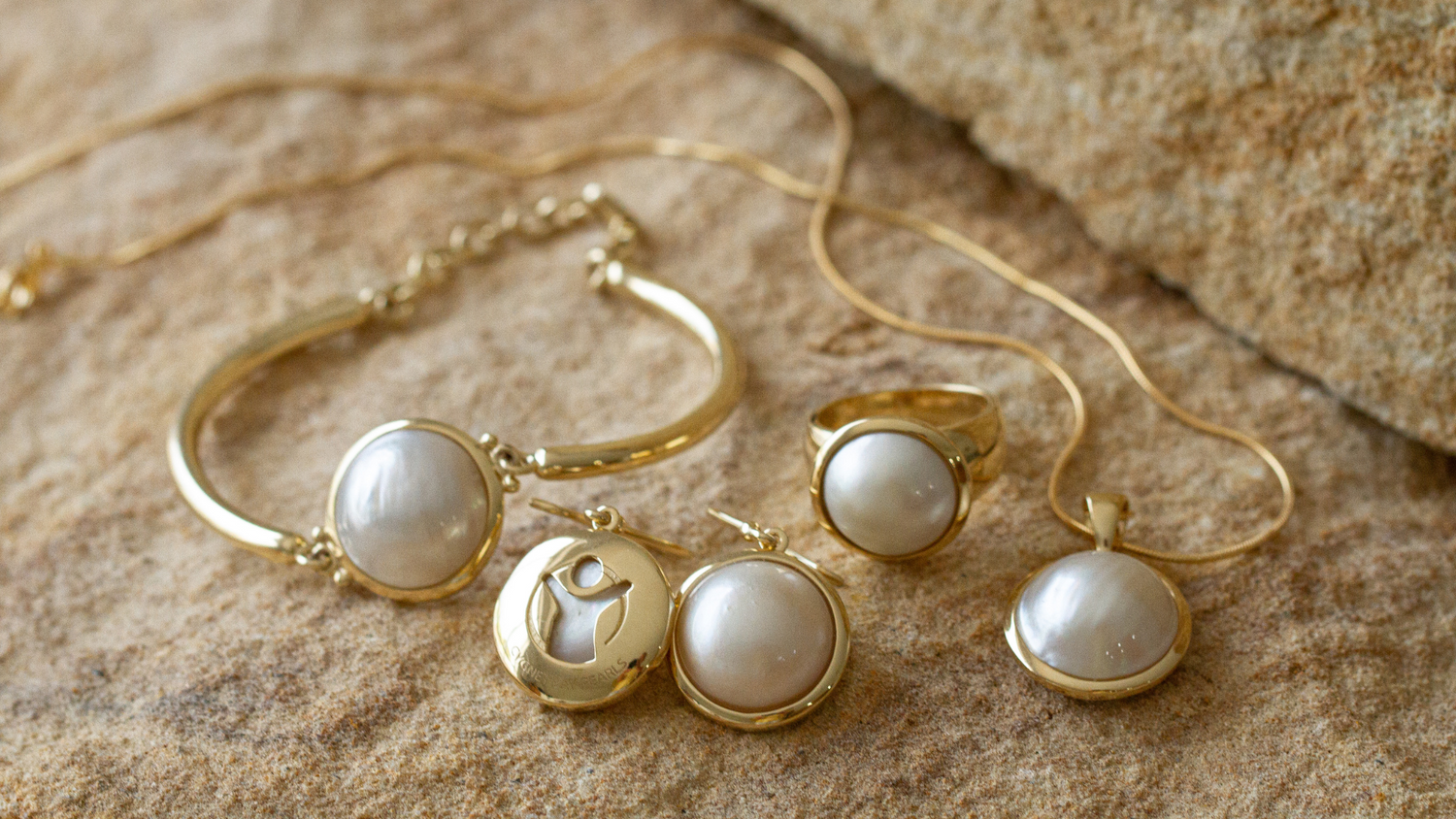 The Save the Children collection features our Australian South Sea mabe pearls that are designed in a pearl bracelet, pearl hooks, pearl pendant and pearl ring.