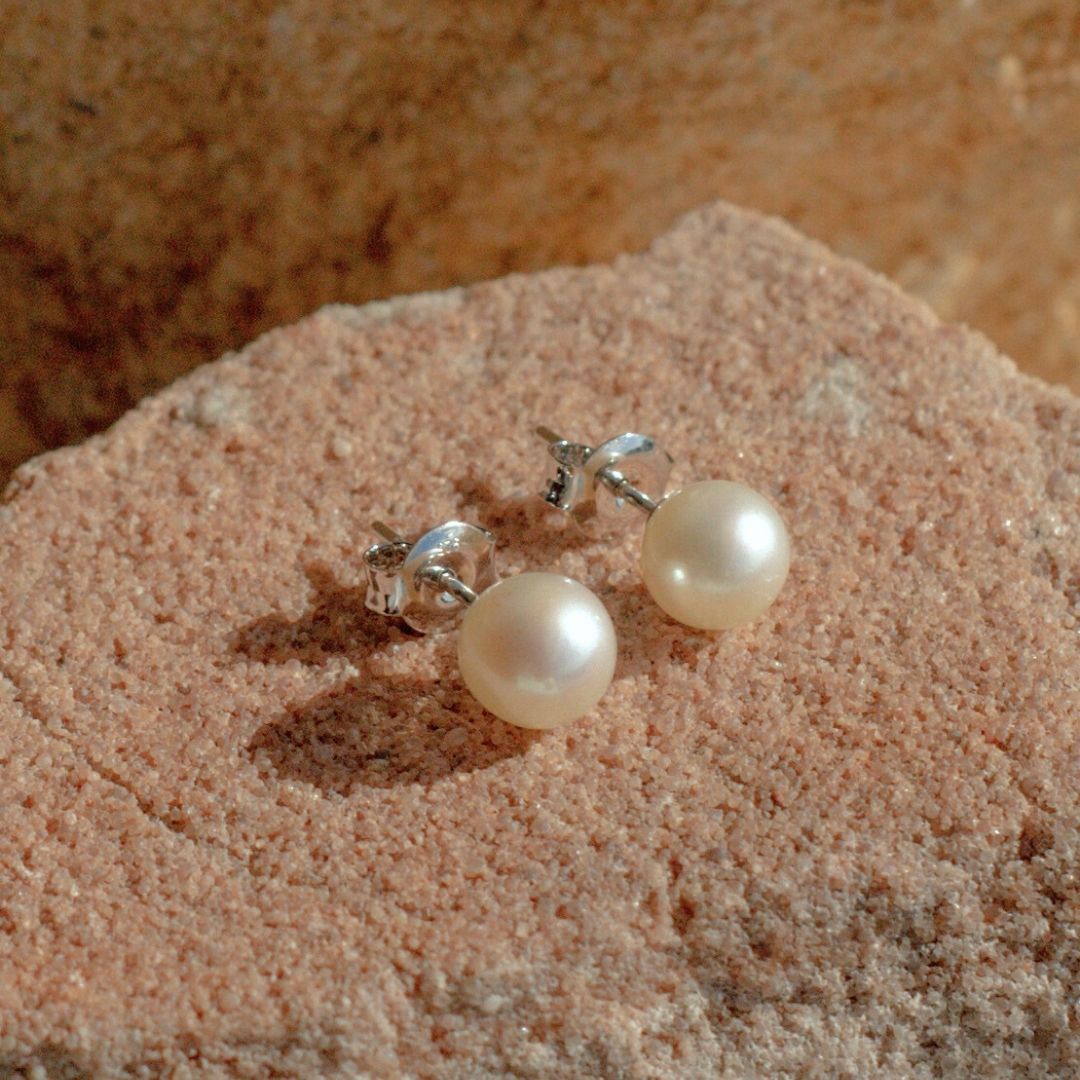 A pair of classic round pair of Australian Akoya pearls shining with its innate lustre and colour.