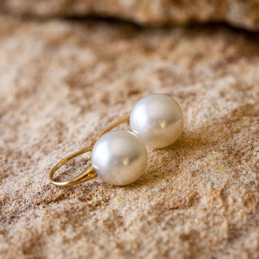 A pair of stunning Australian South Sea pearl hook earrings shine with their natural lustre and colour.