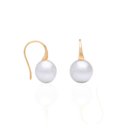 A pair of Australian South Sea pearl hook earrings set in yellow gold.