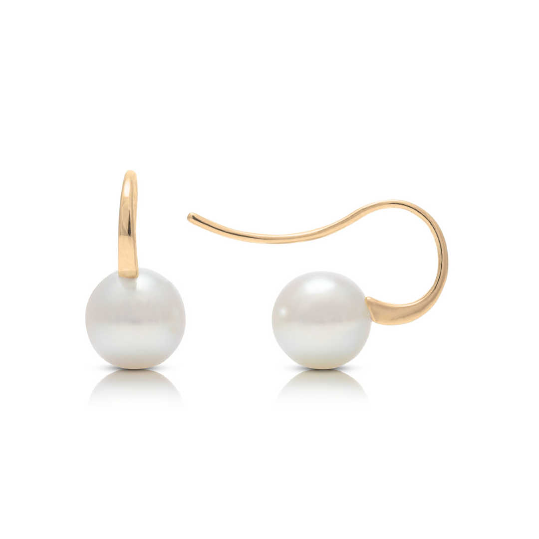 A pair of Australian Akoya pearl hook earrings set in yellow gold.