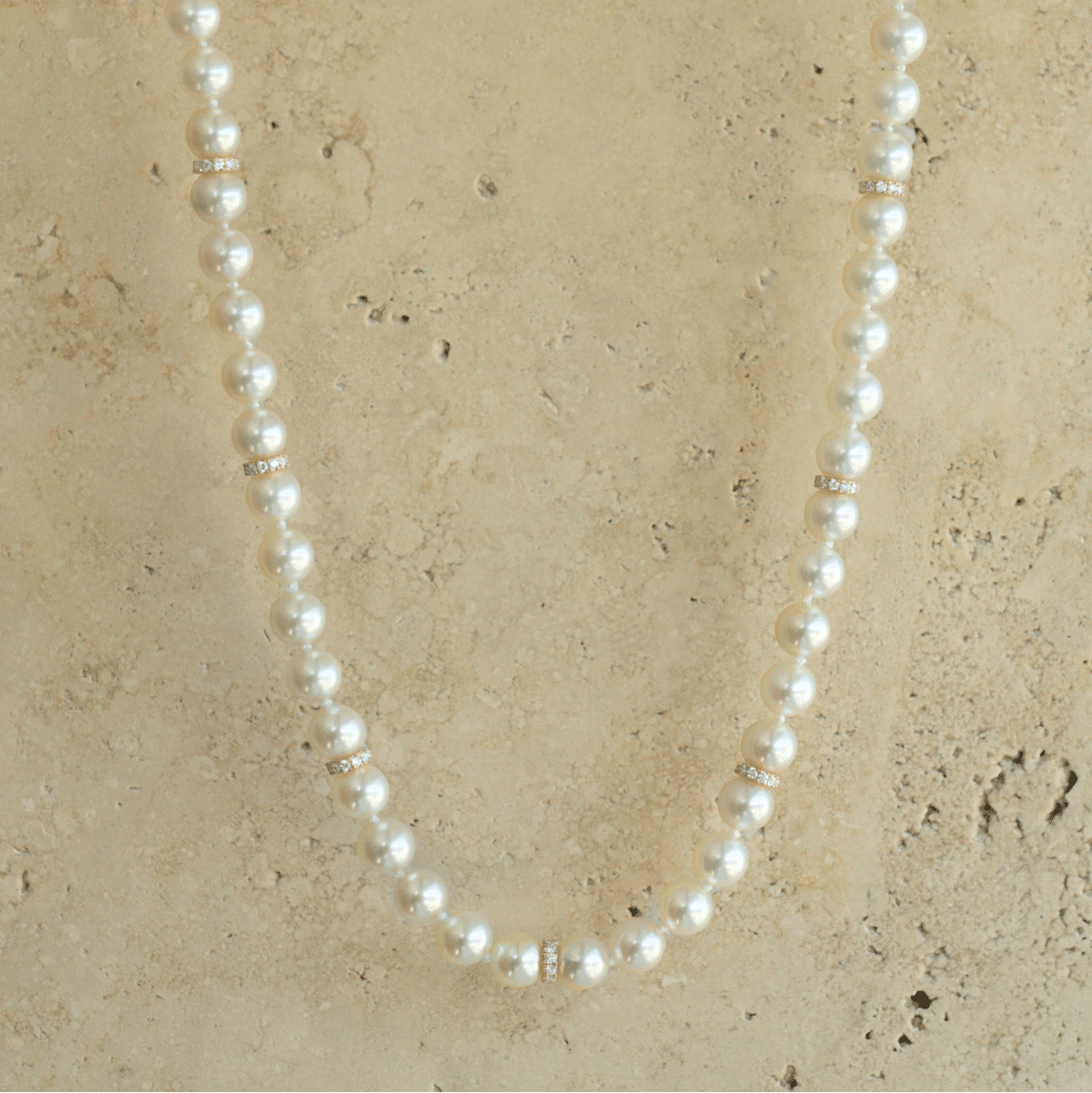 This striking Pearl Strand Diamond Rondel Necklace features sixty (60) 6.5mm Round AAA grade Broken Bay (NSW) grown Australian Akoya pearls. This 46cm pearl strand is complimented by 77 White Diamonds, set with an 18ct Yellow Gold clasp.