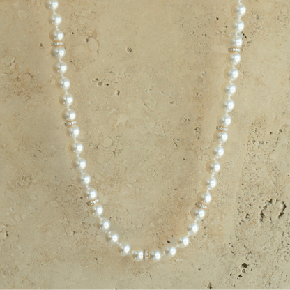 This striking Pearl Strand Diamond Rondel Necklace features sixty (60) 6.5mm Round AAA grade Broken Bay (NSW) grown Australian Akoya pearls. This 46cm pearl strand is complimented by 77 White Diamonds, set with an 18ct Yellow Gold clasp.