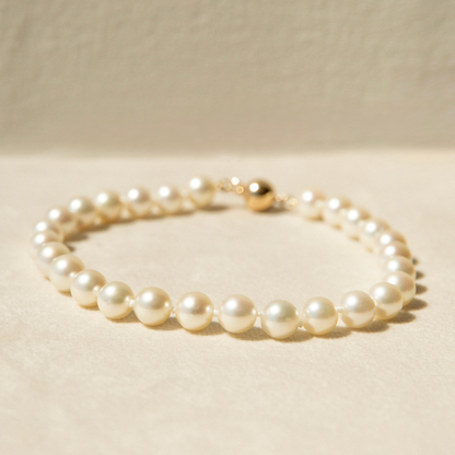 Pearl bracelet on a beige background