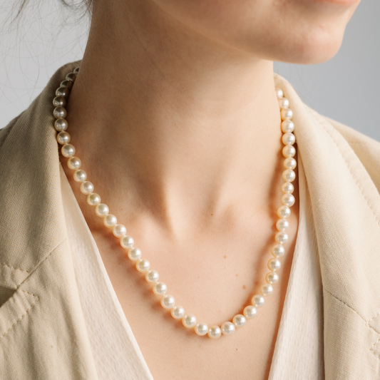 This striking Pearl Strand Necklace features sixty-two (62) 7mm Round AAA grade Broken Bay (NSW) grown Australian Akoya pearls. This pearl strand is carefully hand strung with silk and set with a 9ct Yellow Gold Ball Clasp.