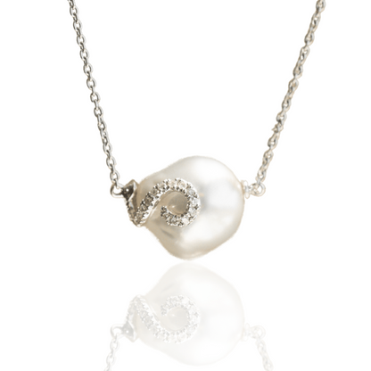 A beautiful Australian South Sea baroque pearl necklace set with an organic shaped diamond design.