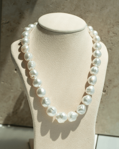 This striking Pearl Strand Necklace features thirty-one (31) 11 to 15.5mm Baroque A3+ to B2+ grade Cygnet Bay (WA) grown Australian South Sea pearls. This pearl strand is set with a 18ct White Gold clasp.