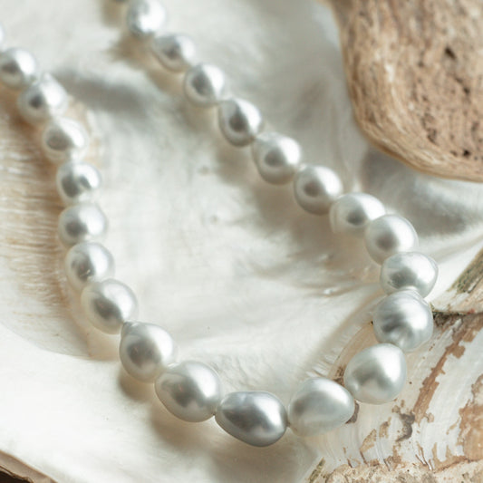 This striking Pearl Strand Necklace features thirty-five (35) 11 to 14.5mm Baroque A2+ to B1 grade Cygnet Bay (WA) grown Australian South Sea pearls. This pearl strand is set with a 18ct White Gold clasp.