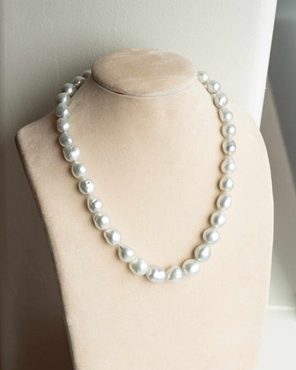 This striking Pearl Strand Necklace features thirty-five (35) 11 to 14.5mm Baroque A2+ to B1 grade Cygnet Bay (WA) grown Australian South Sea pearls. This pearl strand is set with a 18ct White Gold clasp.