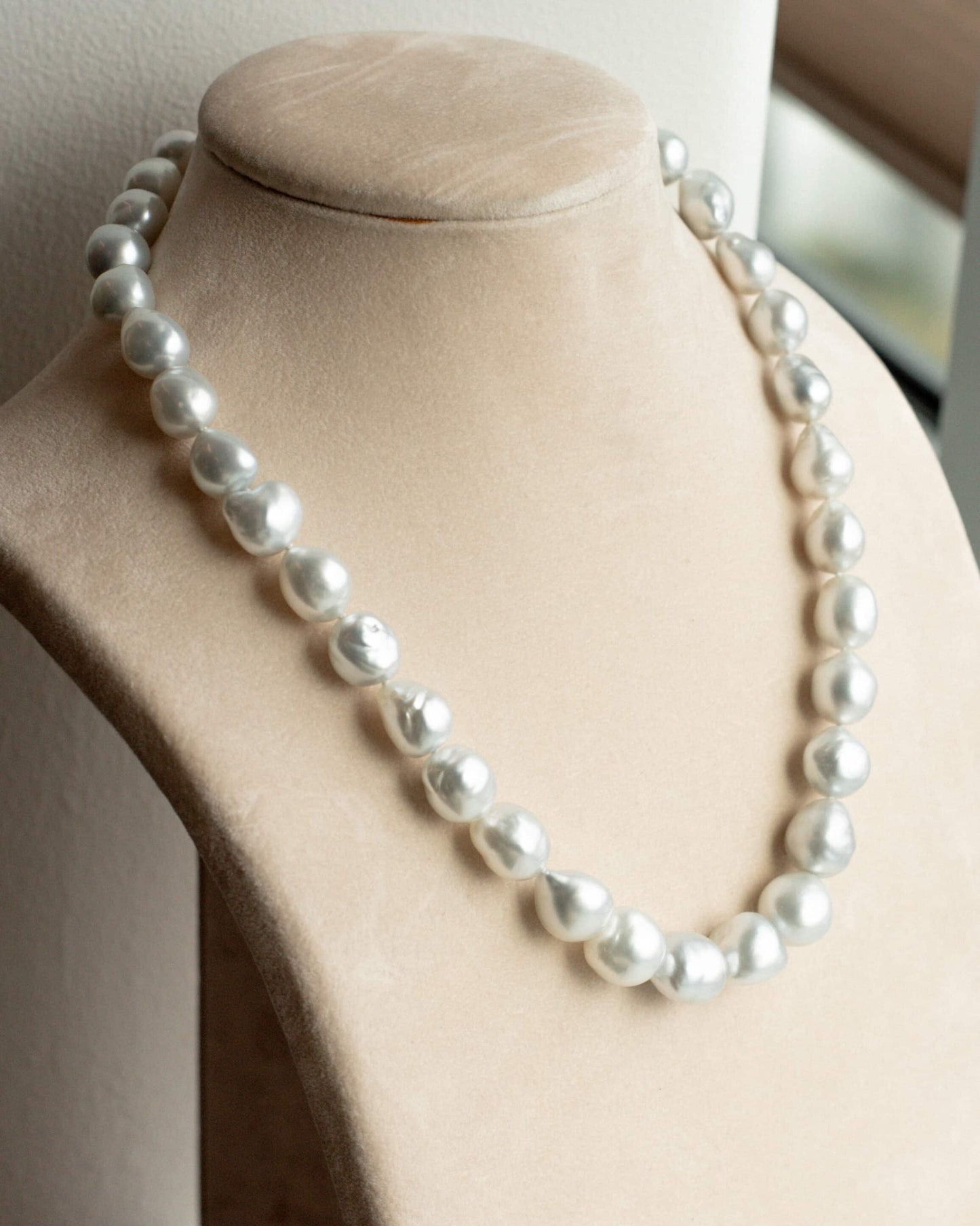 This striking Pearl Strand Necklace features thirty-five (35) 11 to 14.5mm Baroque A2+ to B1 grade Cygnet Bay (WA) grown Australian South Sea pearls. This pearl strand is set with a 18ct White Gold clasp.