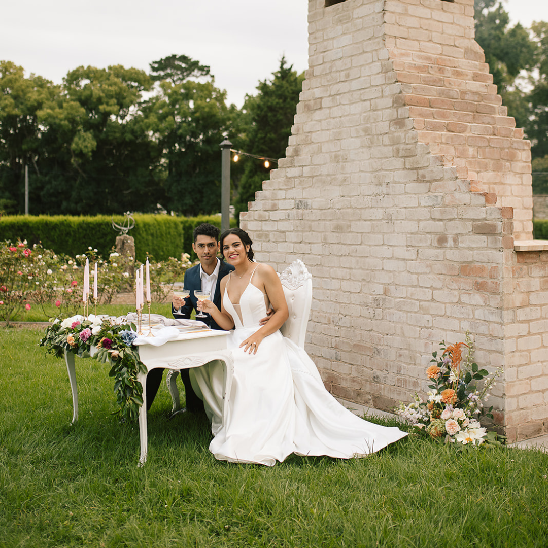A couple smiling on their wedding day. The bride wears her beautiful Pearls of Australian pearl jewellery items.