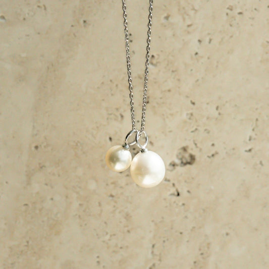 A charming set featuring an Australian South Sea pearl and Australian Akoya pearl hung on a chain.