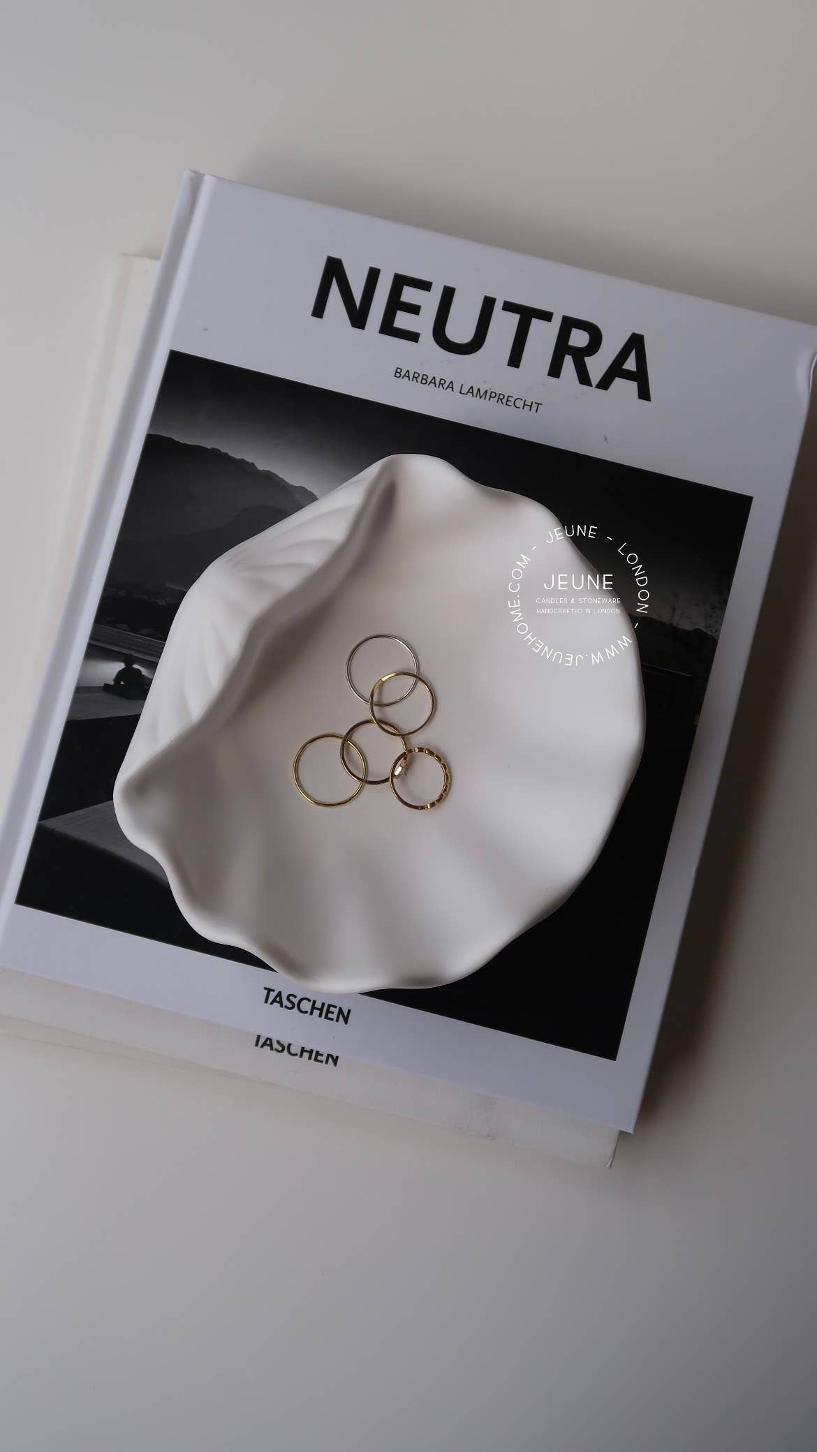 Made with an eco-resin, sealed against light stains and humidity and finished with small round feet on the bottom to protect your furniture from scratches. Perfect for holding jewellery, trinkets, and other small items.

