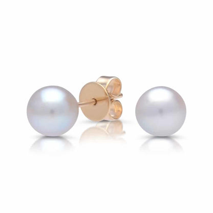 A pair of classic akoya pearl studs set in solid yellow gold.