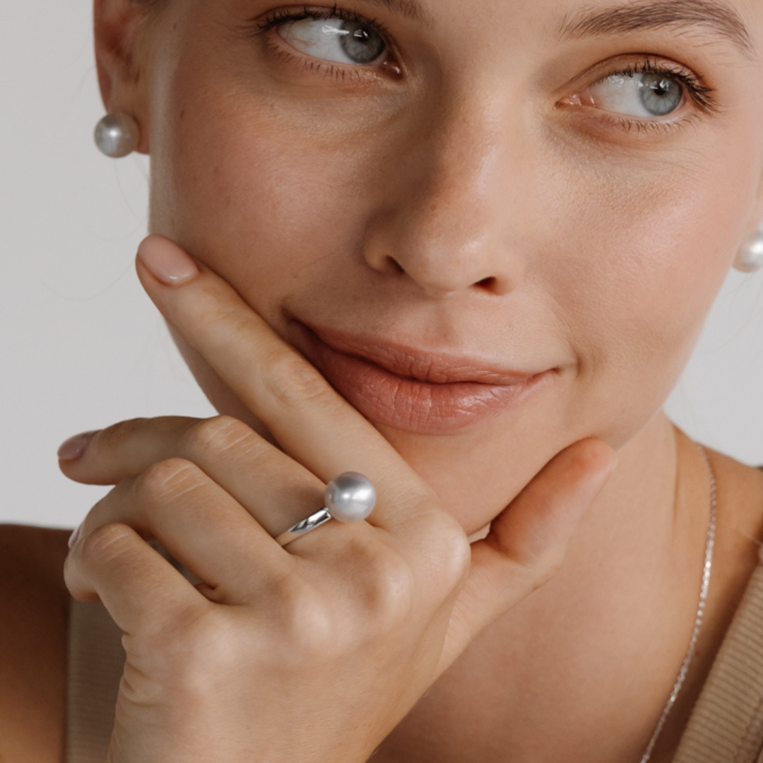 A woman wears her stunning Cocos Pearl Ring featuring Cygnet Bay grown Australian South Sea pearl set in gold.