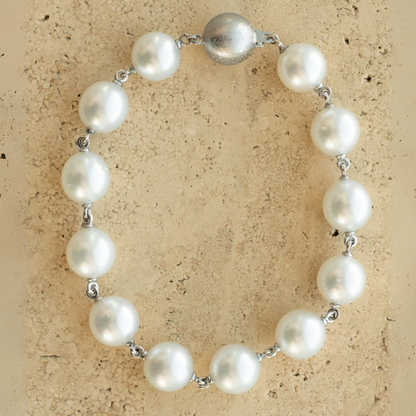 A Cocos Pearl Strand Bracelet featuring Australian South Sea pearls set in gold. 